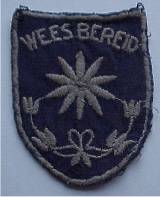 Het installatieteken van het Nederlands Padvindsters Gilde, opgespeld bij de installatie van een nieuwe lid.